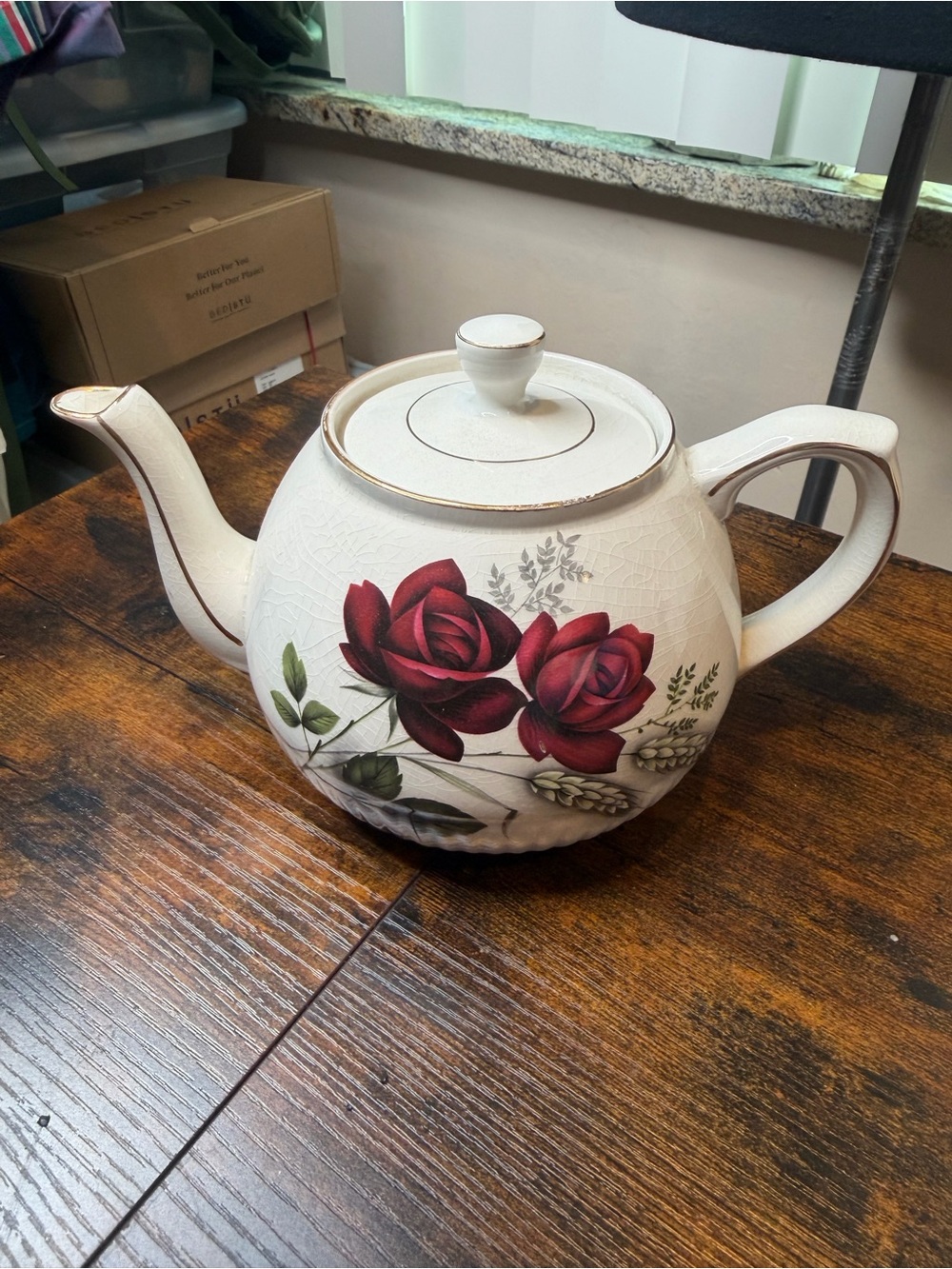 Vintage Ellgreave England red rose teapot featuring delicate gold trim.